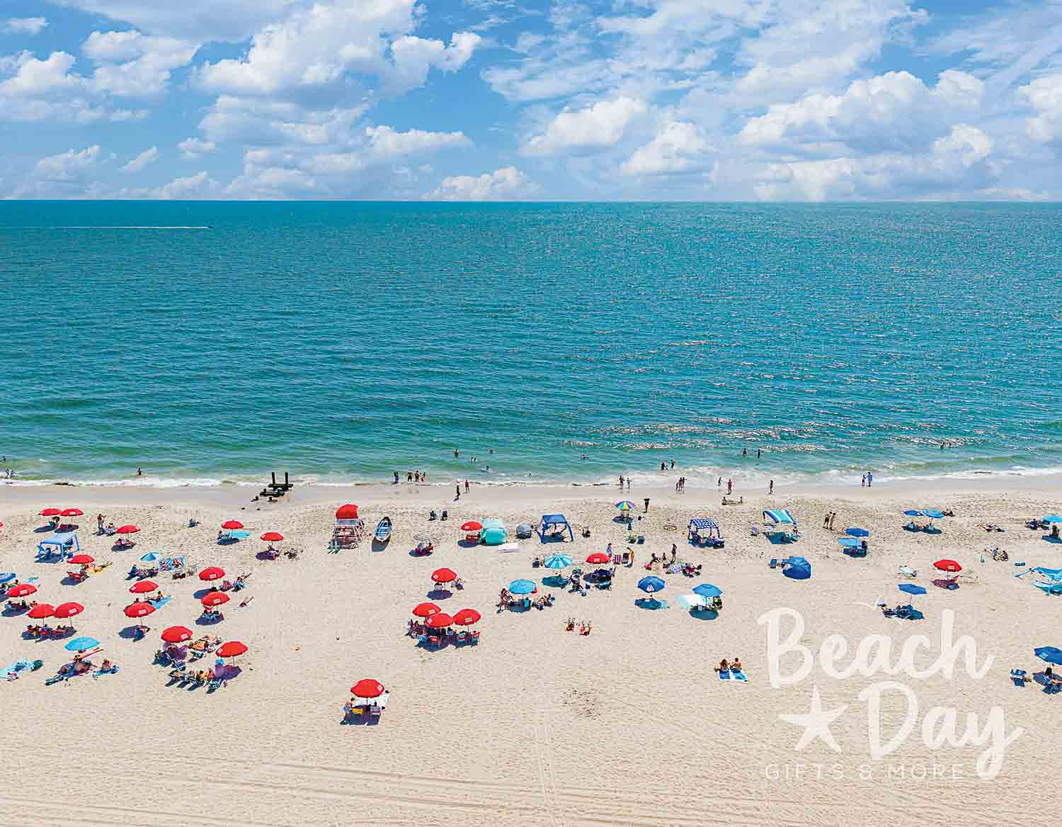 February: Aerial view of colorful beach umbrellas along Cape May's sandy shoreline