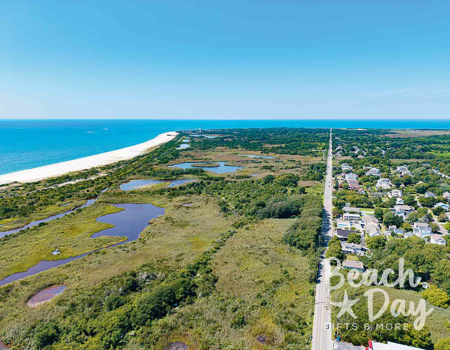 April: Aerial view of Cape May's coastal wetlands, ocean, and shoreline road