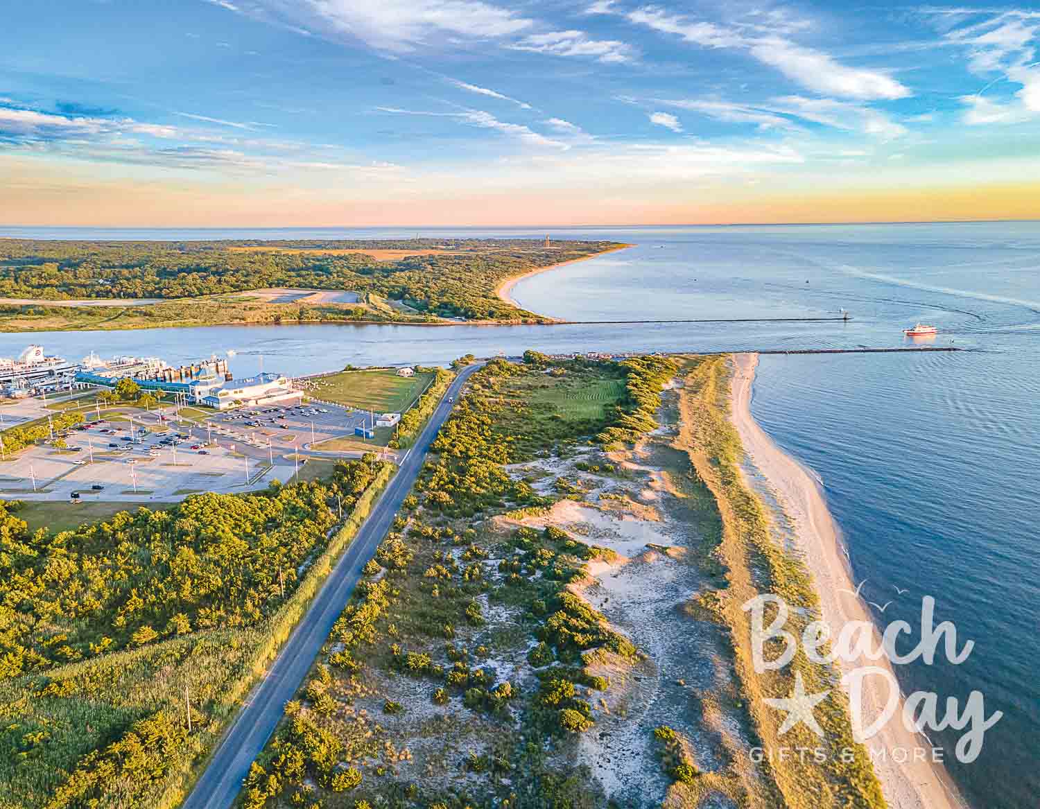 June: Aerial view of Cape May's coastal inlet, sandy shoreline, and surrounding wetlands