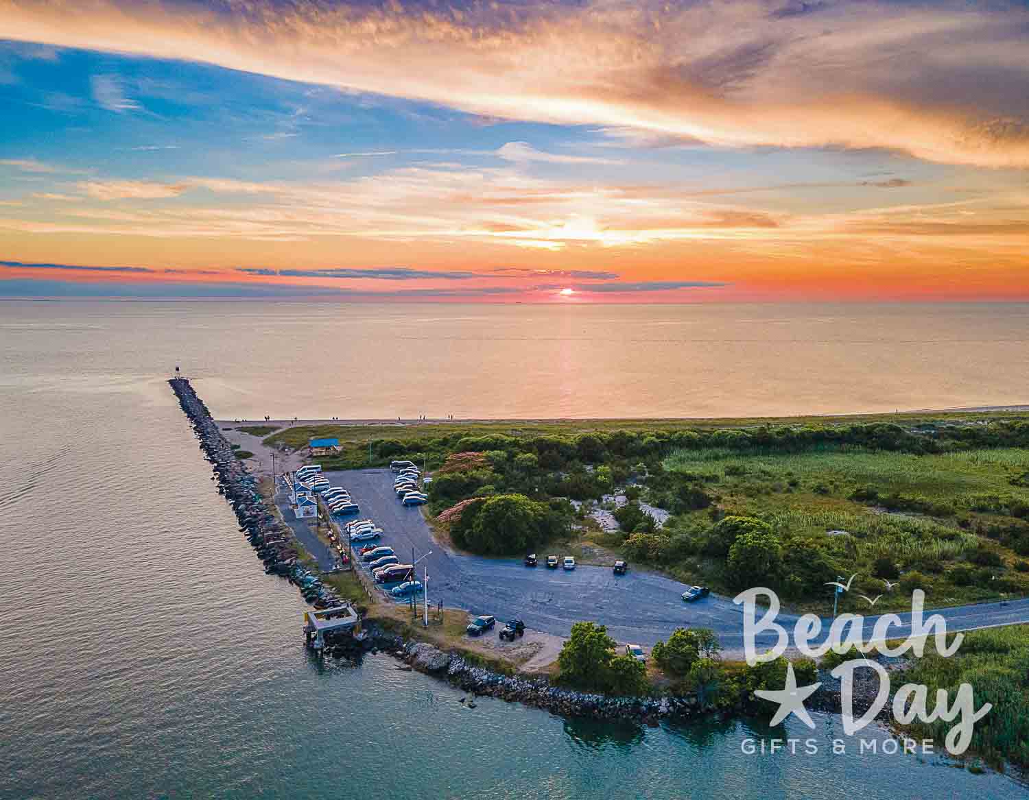 December: Aerial sunset view of Cape May's rocky jetty and waterfront