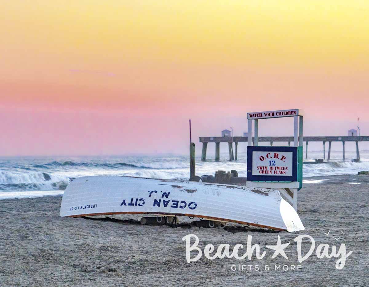 Ocean City Beach Patrol lifeguard boat on the beach beside the fishing pier at sunrise