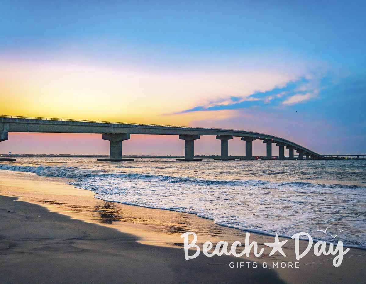 Ocean City Longport Bridge stretching across the water beneath a colorful sunset