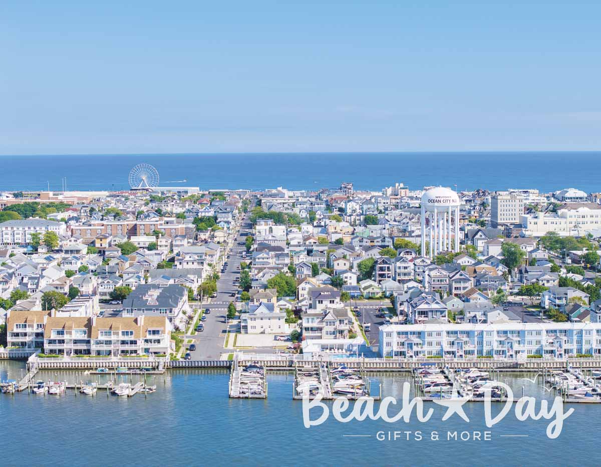 Aerial view of Ocean City NJ from the bay with the water tower, homes, boardwalk and ocean