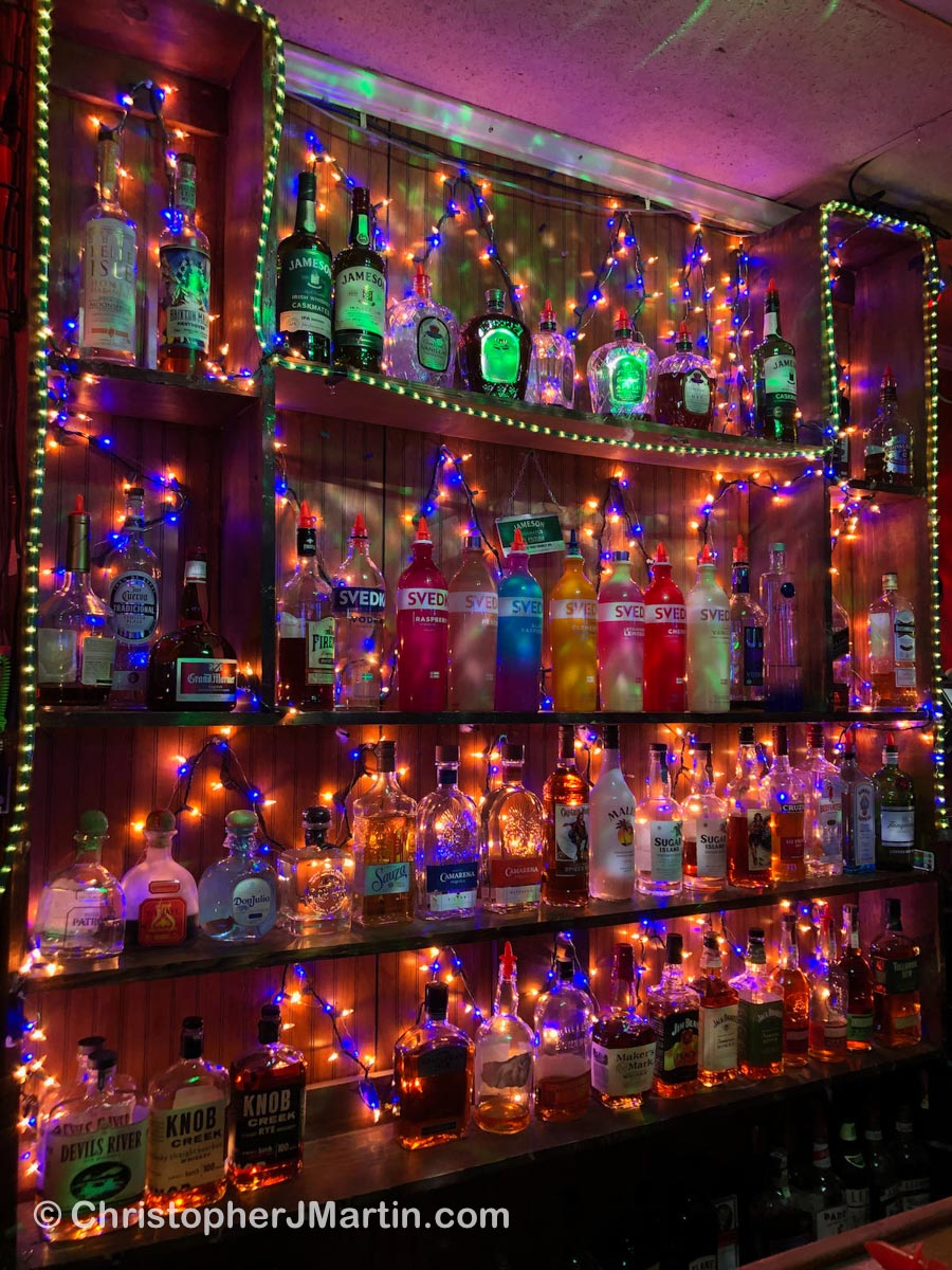 A wall of spirits at Bay Street Blues, Savannah